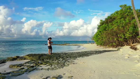 One girl loves life on exotic sea view beach wildlife by blue sea and white sandy background of the 