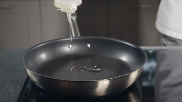 Pouring Oil Into Frying Pan Slow Motion