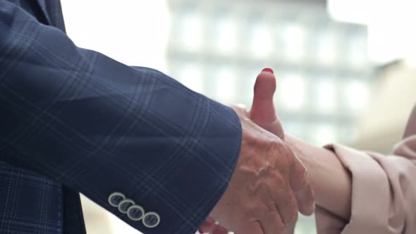 Handshake in the Courtyard of the Office Center