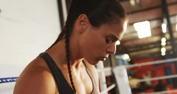 Female boxer standing in the ring