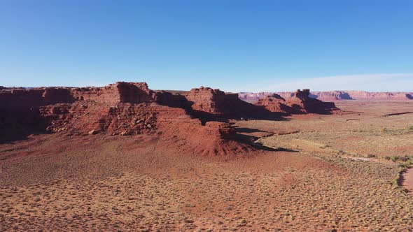 Aerial At Canyon With Red Rocks In The Dried Desert With Red Sand Western Usa