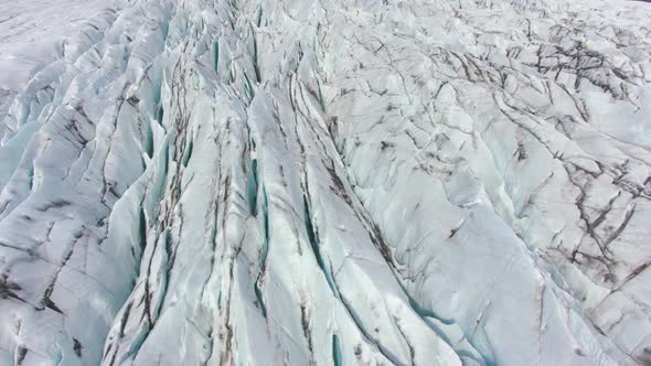 Icelandic Glacier, Ash, Cracks and Crevasses. Iceland. Aerial View