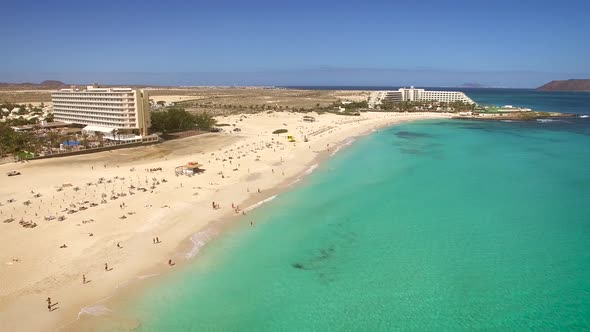Aerial view of Corralejos Big Beaches with turquoise sea in Fuerteventura.