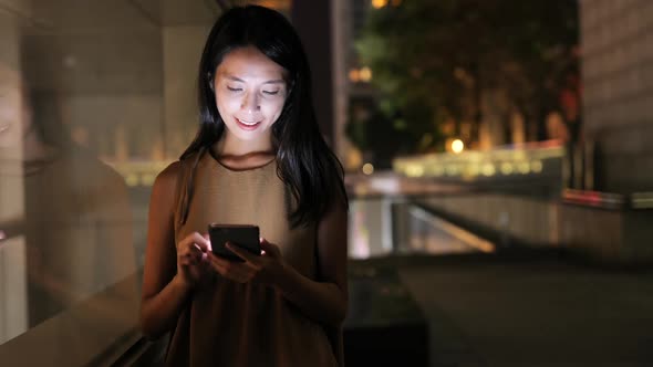 Woman Using Smart Phone at Night 