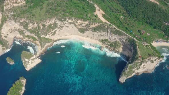 Aerial View Mesmerizing Turquoise Waves Lapping on Cozy Atuh Diamond Beach