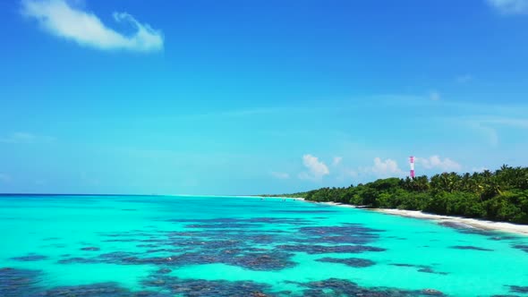 Aerial tourism of idyllic seashore beach holiday by transparent water with bright sand background of