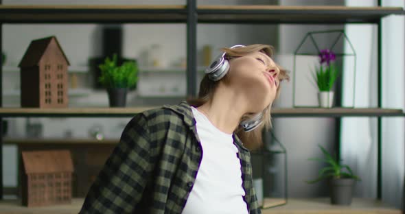 Woman in Romantic Mood Is Dancing in Headset, Close Up