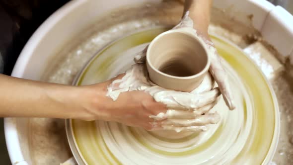 Making pottery on the potter's wheel