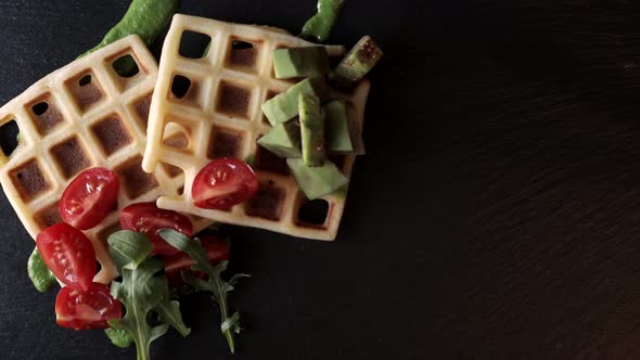 Making food top view. Presentation Fresh baked Belgian waffles with arugula