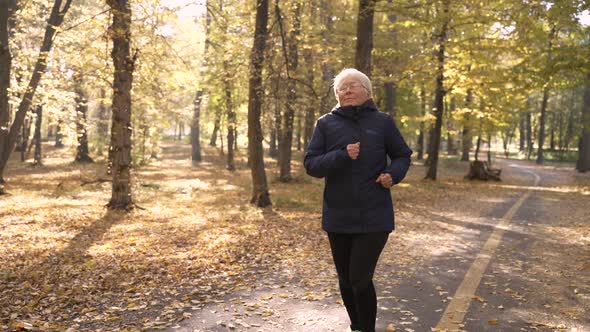 Old Woman Heart Burn While Jogging Outdoor