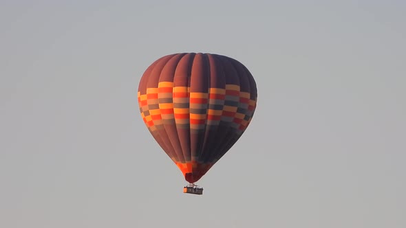Hot Air Balloon Flying in Still Cloudless Clear Sky