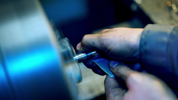 Machine in for metal works. Industrial worker working on machine in factory