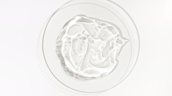 Rotation of Transparent Cosmetic Gel Fluid with Bubbles in a Glass Bowl of Petri