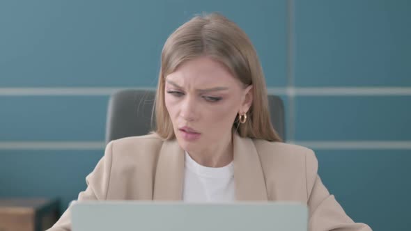 Close Up of Businesswoman Coughing While Working on Laptop