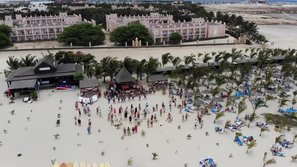 Aerial footage showing people dancing and having fun on the beach of Cape Verde