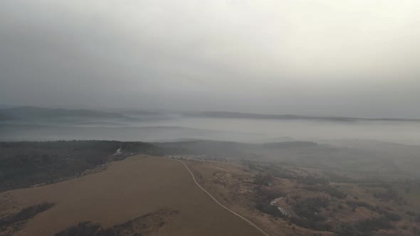 4k Drone Shot Over Hills Near Forest In Fall