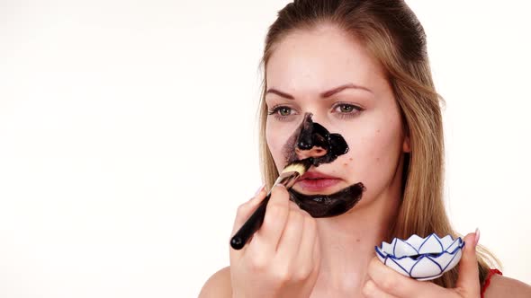 Girl Apply Black Carbo Mask