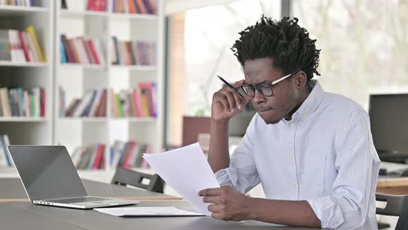 African Man Doing Paperwork