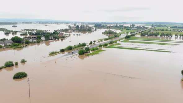 Aerial View River That Overflowed After Heavy Rains and Flooded Agricultural Fields