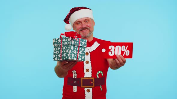 Man in Christmas Tshirt Showing Gift Boxes and 30 Percent Discount Inscriptions Banner Text Note