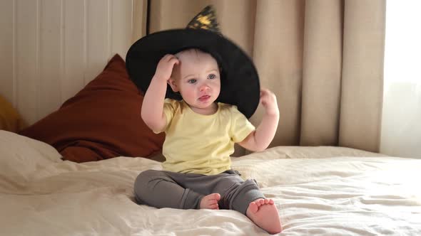 Enthusiastic One Year Old Child in a Witch Costume