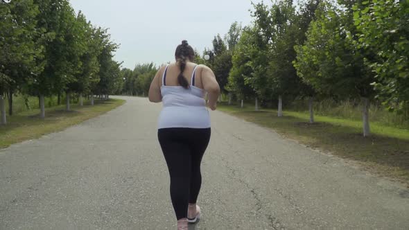 Fat Girl Runs Along the Road