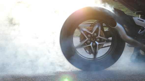 Biker Performing Tire Burnout with Lots of Smoke