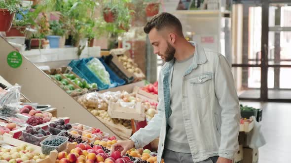 Man Choosing Fresh Fruit at Market