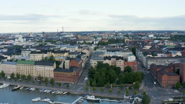 Expansive aerial shot of Helsinki, Finland along the waterfront at dusk.