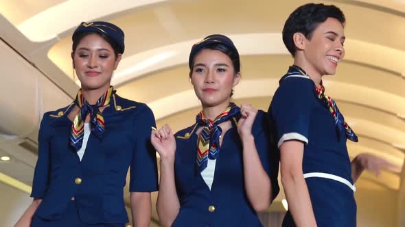 Cabin Crew Dancing with Joy in Airplane