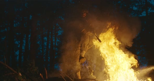 Military Operatives Going Thorugh Action and Juping Over Fire in Dense Forest at Night Concept of