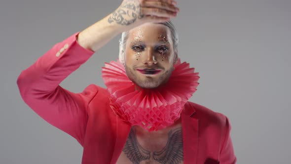 Portrait of Man with Dramatic Make-Up Look and Red Ruff