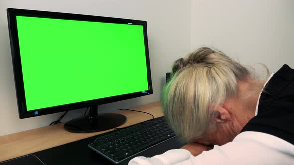 Old Caucasian Woman Sleeps at the Computer in Home - Green Screen