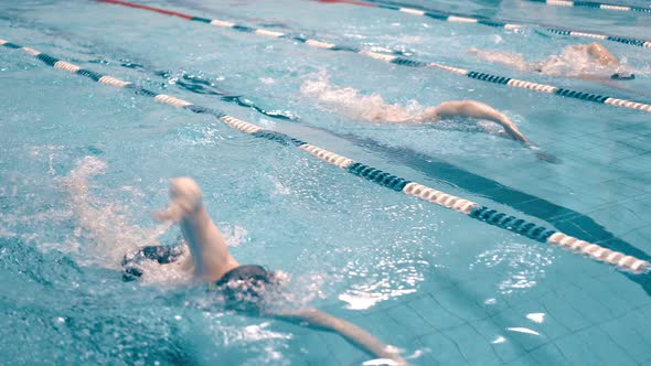 High Angle Tracking Shot Training of Swimmers in Swimming Pool