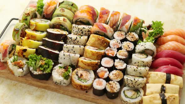 Above View of Various Sushi and Rolls Placed on Wooden Board