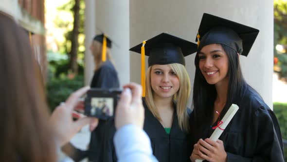 Graduates taking photos together