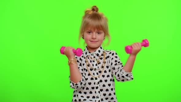 Sportive Kid Girl Working Out Pumping Up Arm Muscles Lifting Pink Dumbbells Practicing Pilates
