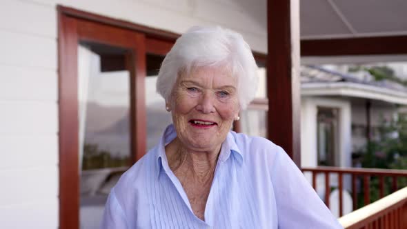 Woman standing in balcony at home 