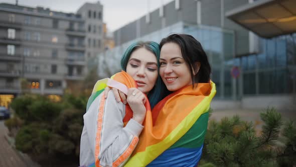 Two Cute Lesbian Women Hugging in Public