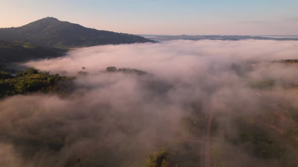 4K Aerial Flying Above Sea of Fog at Sunrise