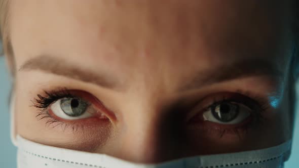 Closeup Shot of a Caucasian Healthcare Professional Female Worker Wearing Protective Mask to Prevent