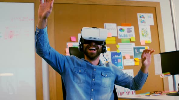 Smiling executive using virtual reality headset