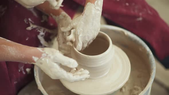 Top View Production of Handmade Tableware the Young Couple Potter Makes a Pitcher Out of Clay