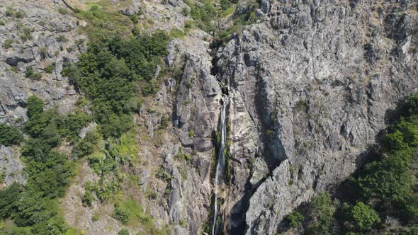 Stream of fresh water, Cascata da Frecha da Mizarela, Arouca, Portugal. Massive waterfall.