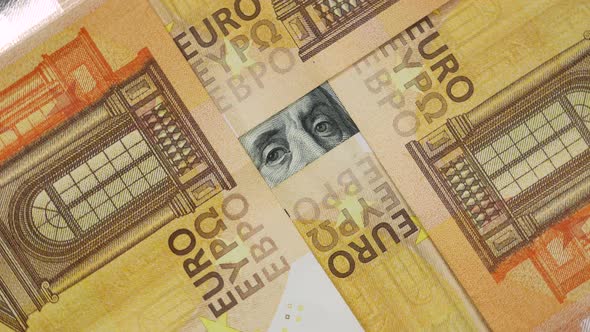 Franklin Eyes Peeping From Pile of Euro Banknotes.