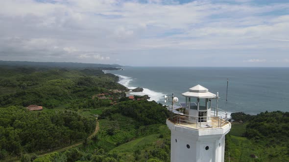 Aerial view of the lighthouse in Indonesian beach