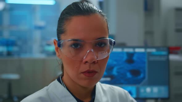 Close Up of Tired Scientist Doctor Looking at Camera Smiling