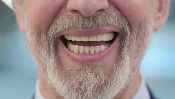 Close Up of Mouth of Smiling Old Businessman