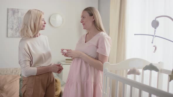 Pregnant Woman Talking To Mother