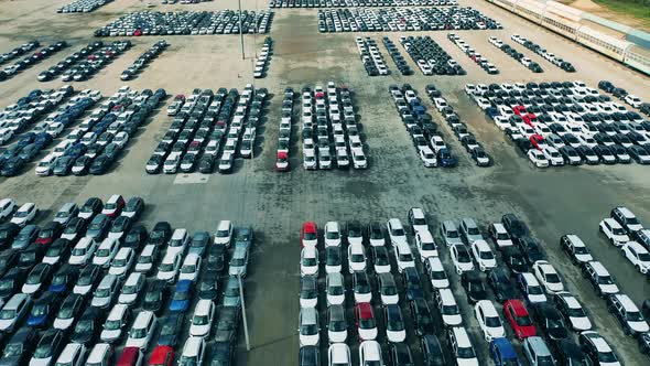 New Cars at Car Dealer Parking Lot.